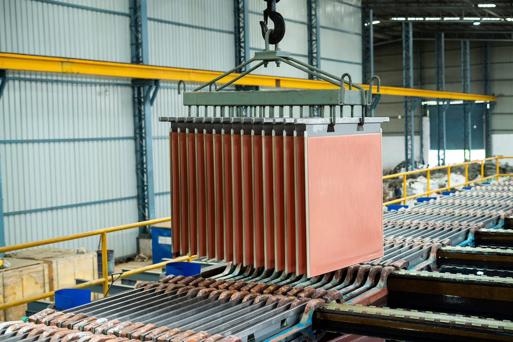 Copper cathode sheets lifted by a crane at the plant